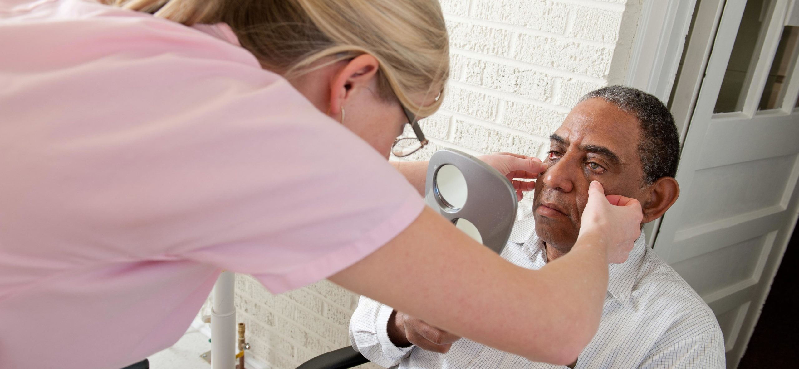Ocularist fitting a patient